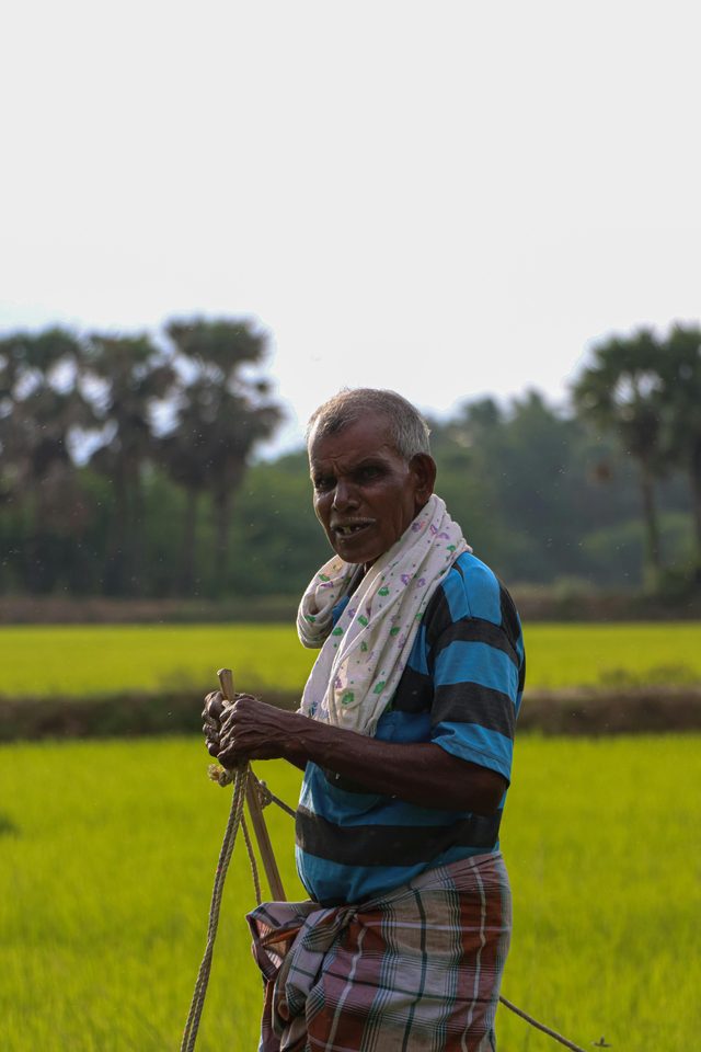 A senior Tamil Nadu farmer in regional attire — the people we build with.